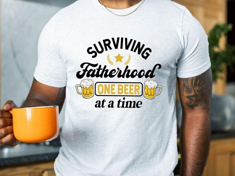 Surviving Fatherhood One Beer At A Time Shirt/T-shirt/Hoodie/Sweater, Funny Father Shirt, Husband Shirt, Fathers Day Gift, Fatherhood Shirt, Beer Dad Shirt
