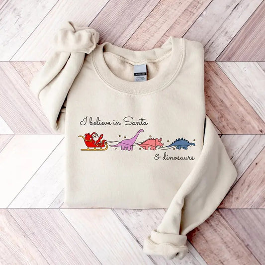 I Believe In Santa And Dinosaurs Sweatshirt, Christmas Santa Claus T-Shirt, Funny Xmas Dinosaurs Sweater, Dino Reindeers Christmas Shirt, Gift For Christmas