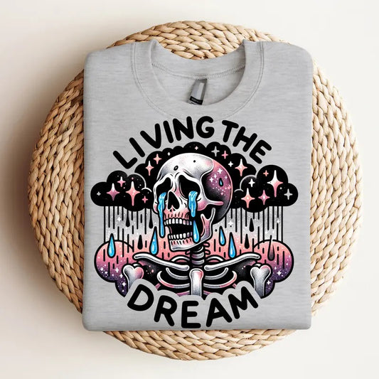 Living the Dream - Crewneck Sweatshirt, Crying Skeleton,  Mental Health, Funny Tee, Bright Graphic, Funny Apparel, Gift Idea, Relaxed Fit, Casual Apparel, Cute Top, Great with Jeans, All Seasons, Fun Style, Comfortable Shirt